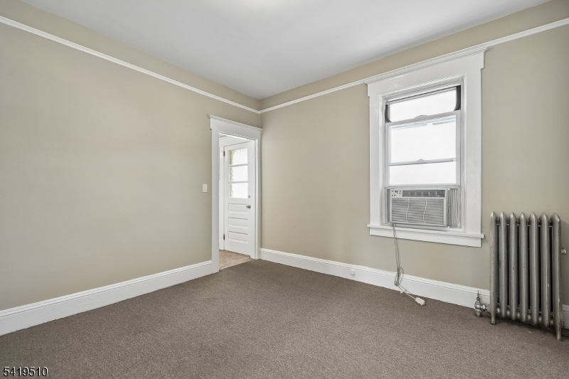 68 North Street, Unit 2 Madison, NJ 07940 - Photo 4 of 18 an empty room with windows
