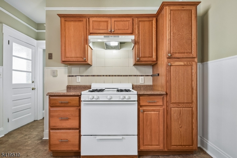 68 North Street, Unit 2 Madison, NJ 07940 - Photo 7 of 18 a kitchen with appliances and cabinets