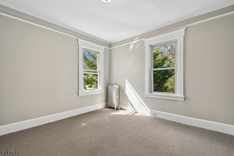 68 North Street, Unit 2 Madison, NJ 07940 - Photo 10 of 18 an empty room with windows