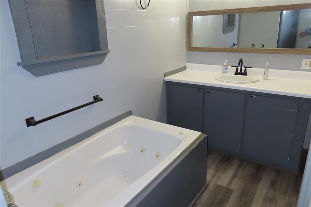 99 Lafayette 215 Road Taylor, AR 71861 - Photo 13 of 18 a bathroom with a bathtub and a sink