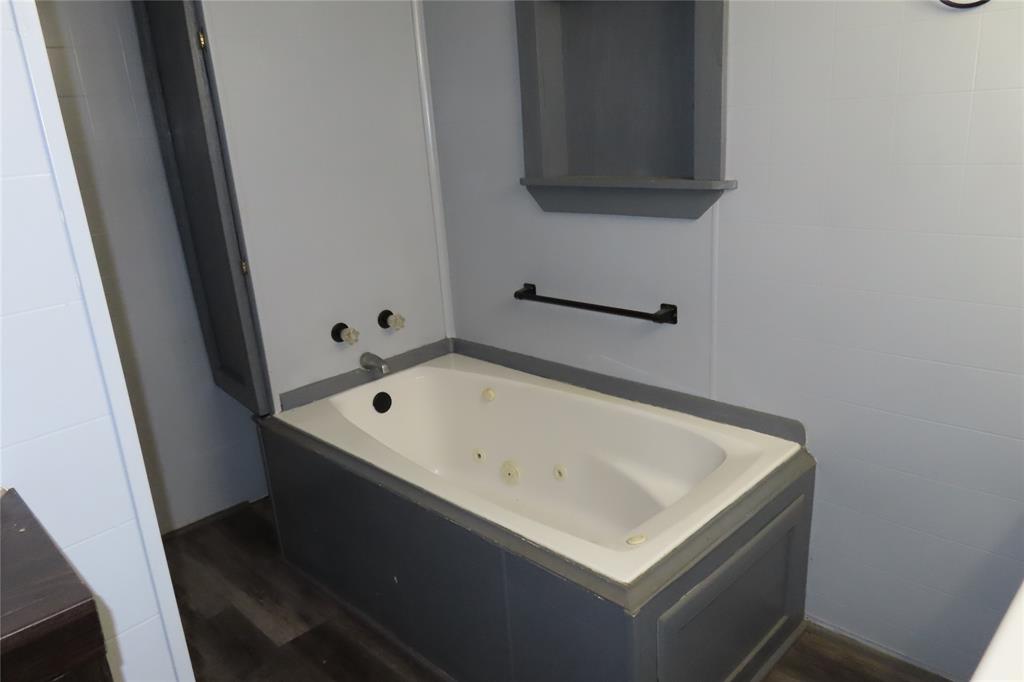 99 Lafayette 215 Road Taylor, AR 71861 - Photo 14 of 18 a white bath tub sitting in a bathroom