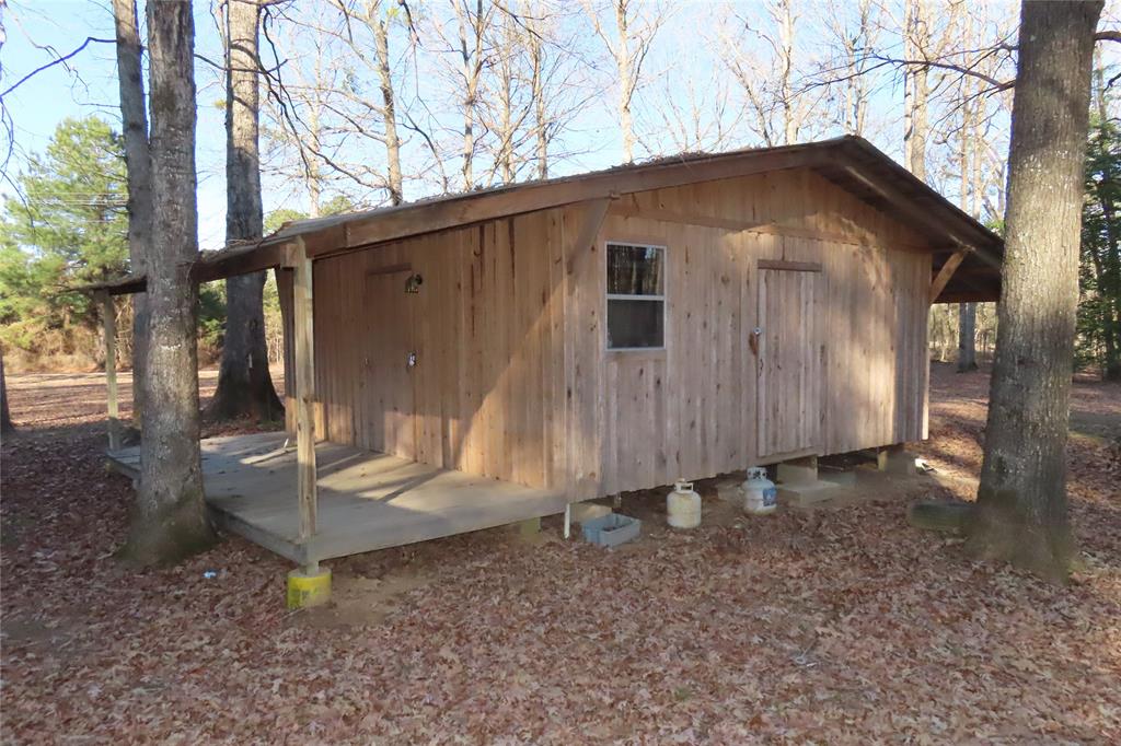 99 Lafayette 215 Road Taylor, AR 71861 - Photo 17 of 18 a view of a small house with backyard