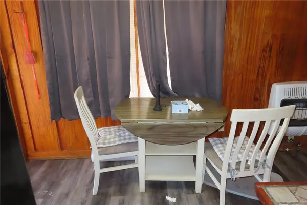 a bedroom with a bed and a flat tv screen