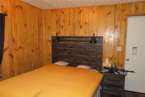 a view of a room with wooden walls