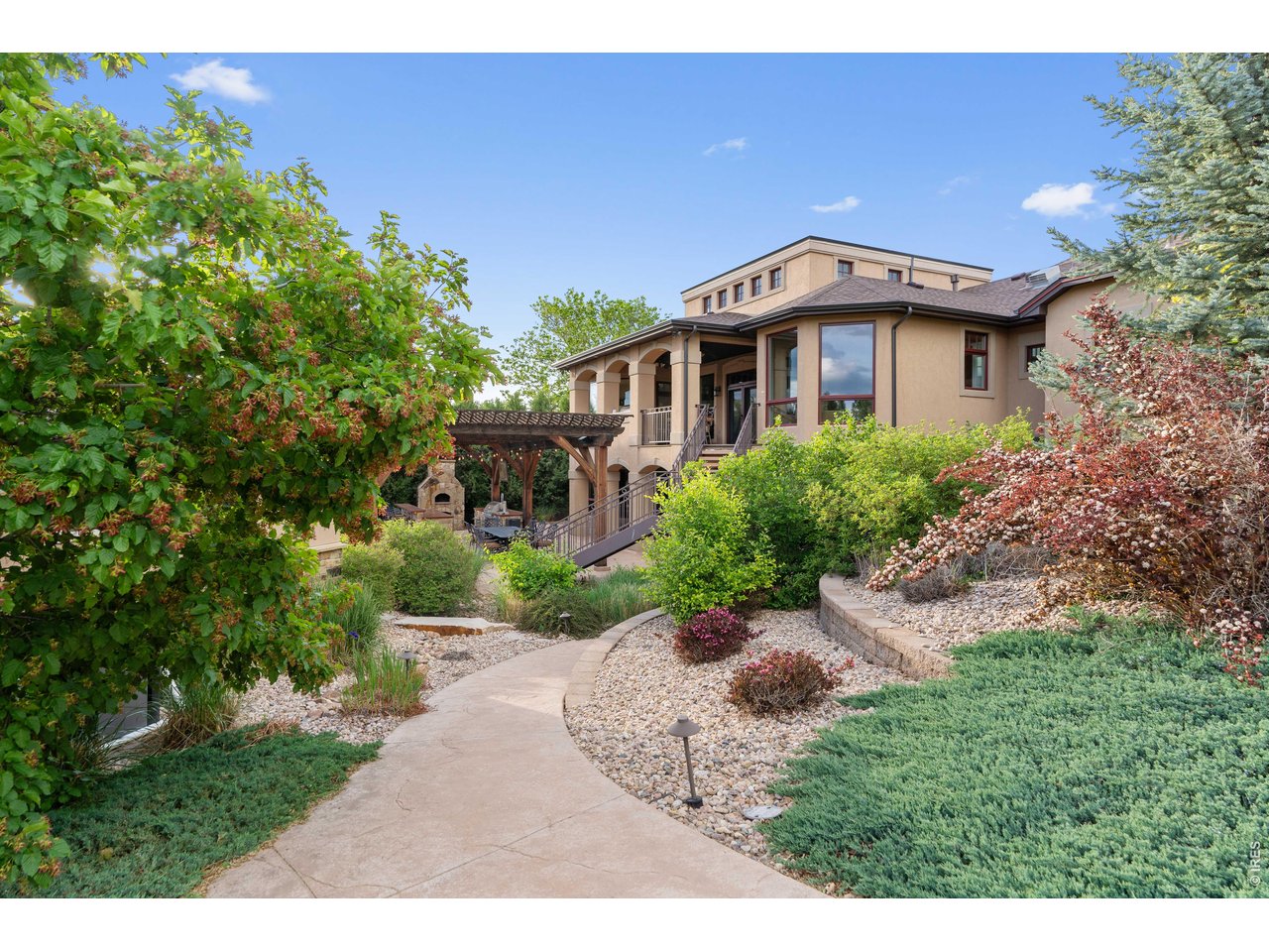 964 Riparian Way Fort Collins, CO 80524 - Photo 13 of 42 a front view of a house with a yard