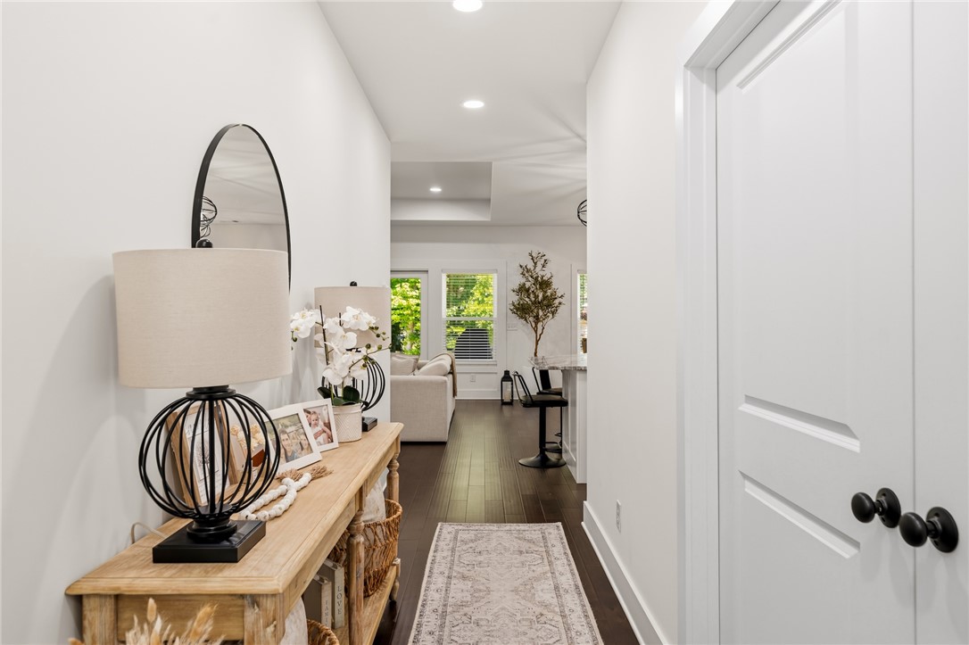 502 Canebrake Drive Anderson, SC 29621 - Photo 35 of 39 This bright hallway connects living spaces with seamless elegance and rich wood flooring.