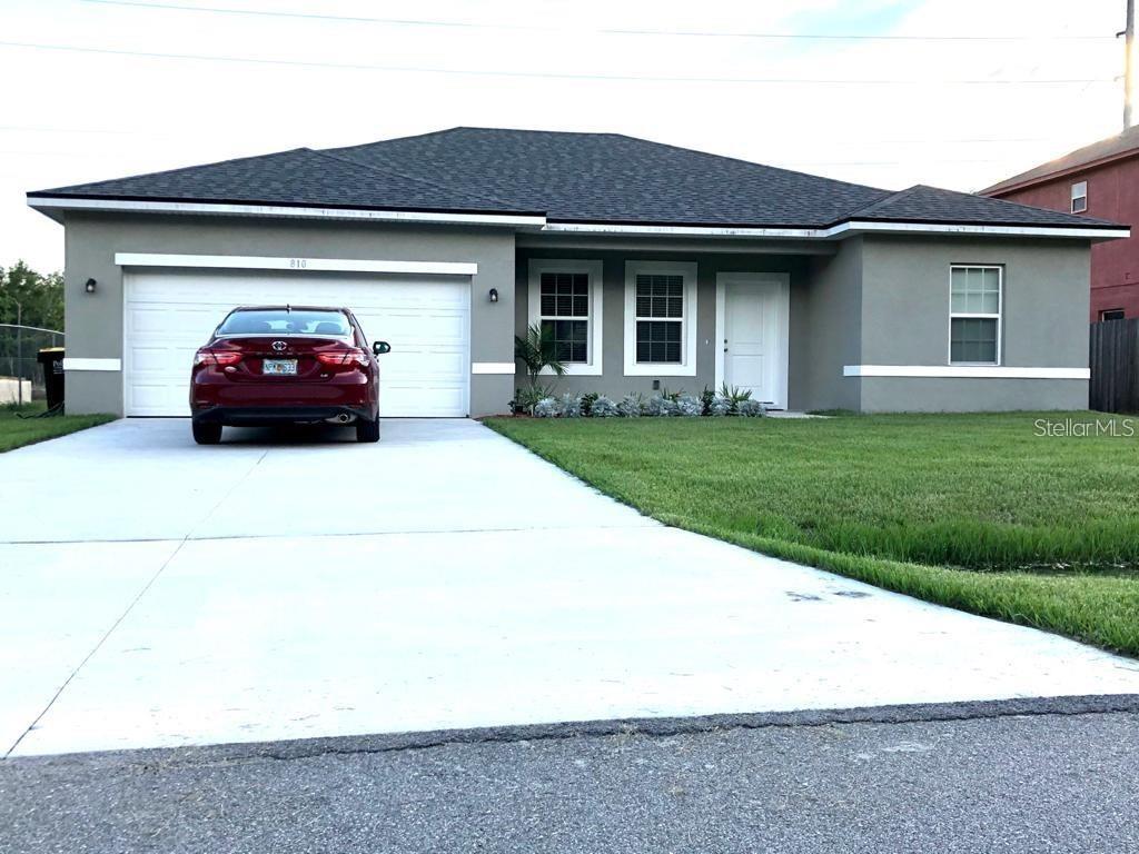810 Cardinal Way Kissimmee, FL 34759 - Photo 1 of 12 a car parked in front of a house