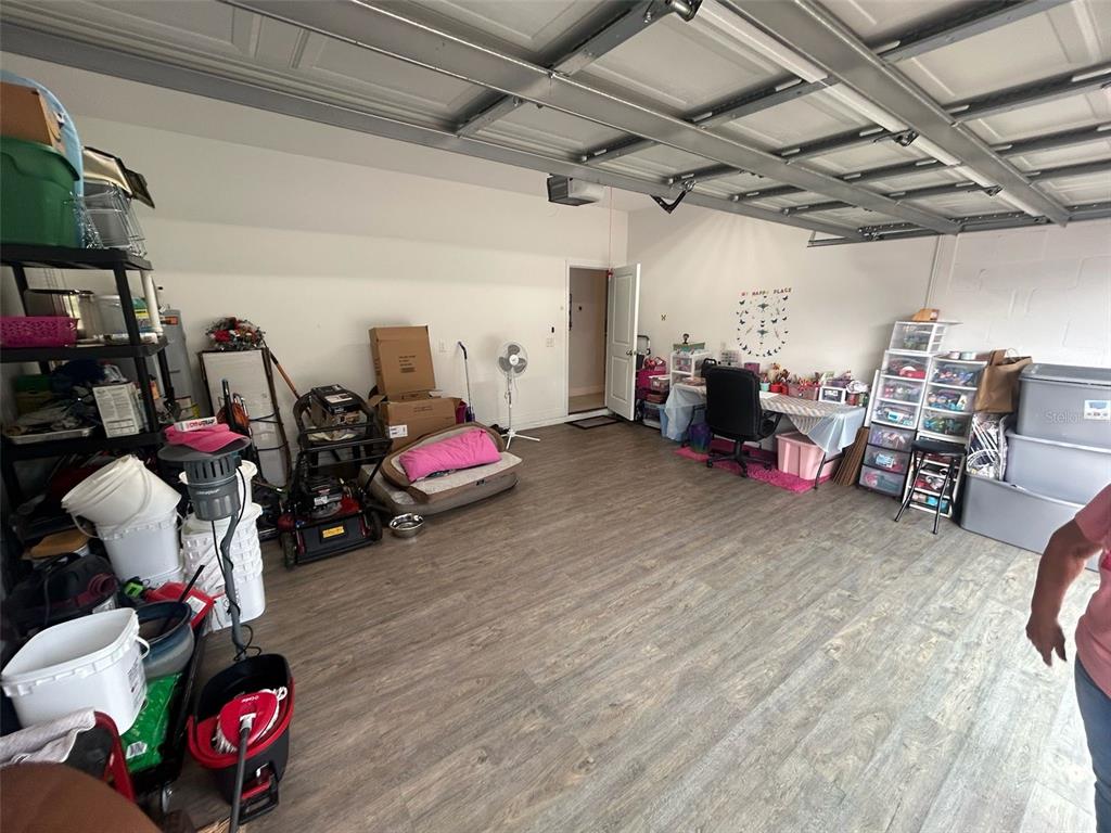810 Cardinal Way Kissimmee, FL 34759 - Photo 11 of 12 a view of a garage with a lot of stuff