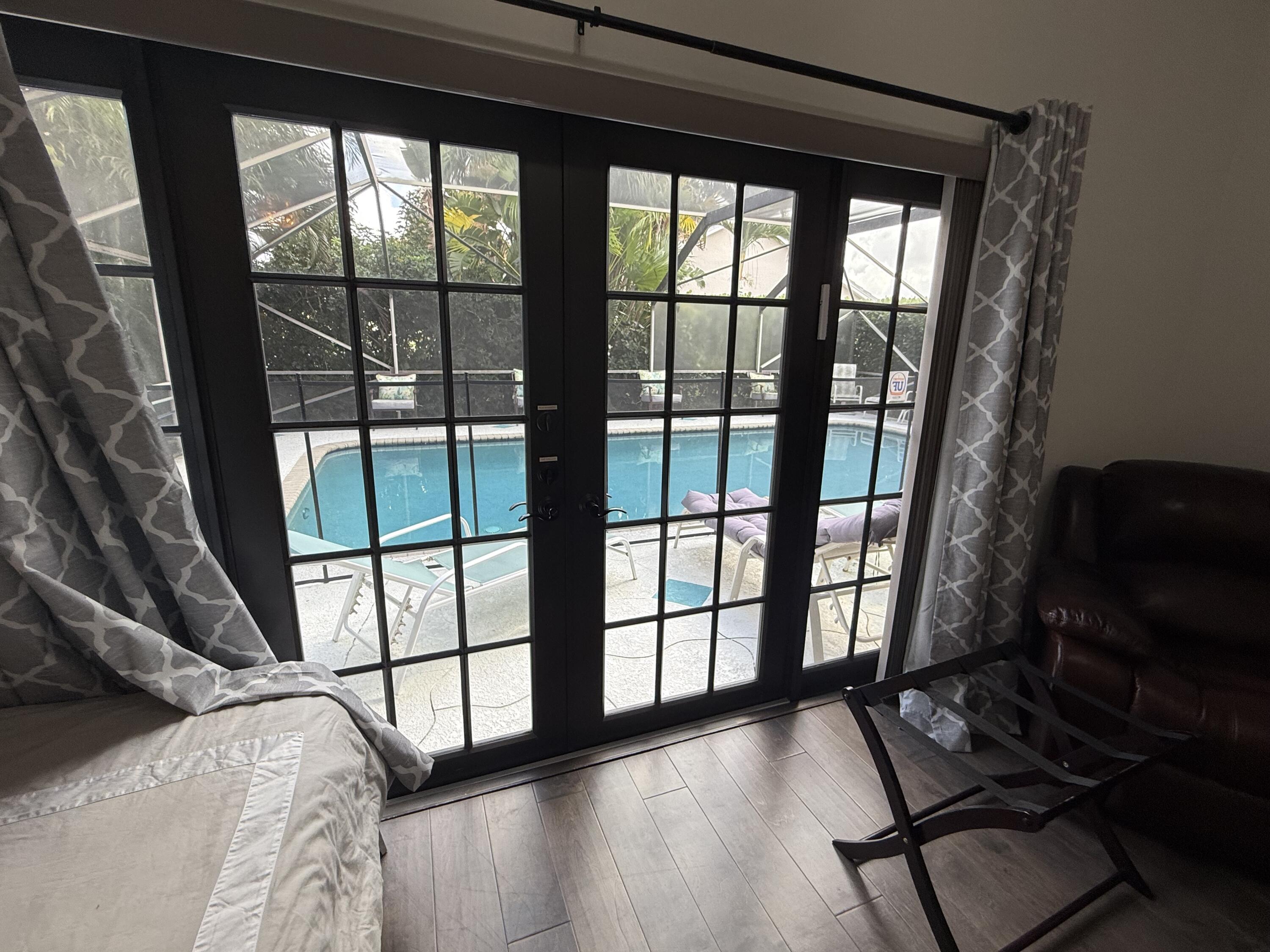 9629 El Clair Ranch Road Boynton Beach, FL 33437 - Photo 19 of 24 a view to the pool