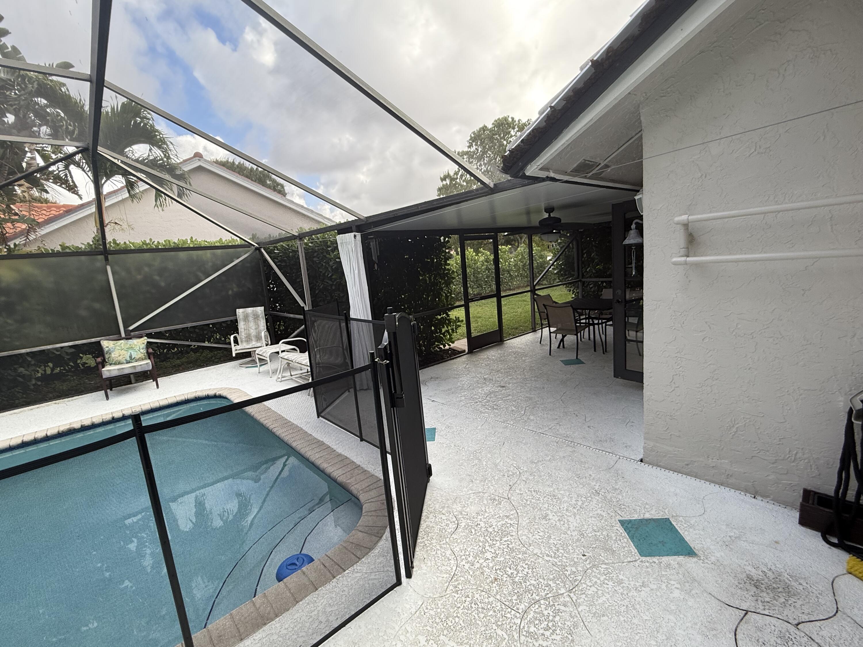 9629 El Clair Ranch Road Boynton Beach, FL 33437 - Photo 22 of 24 the pool and patio