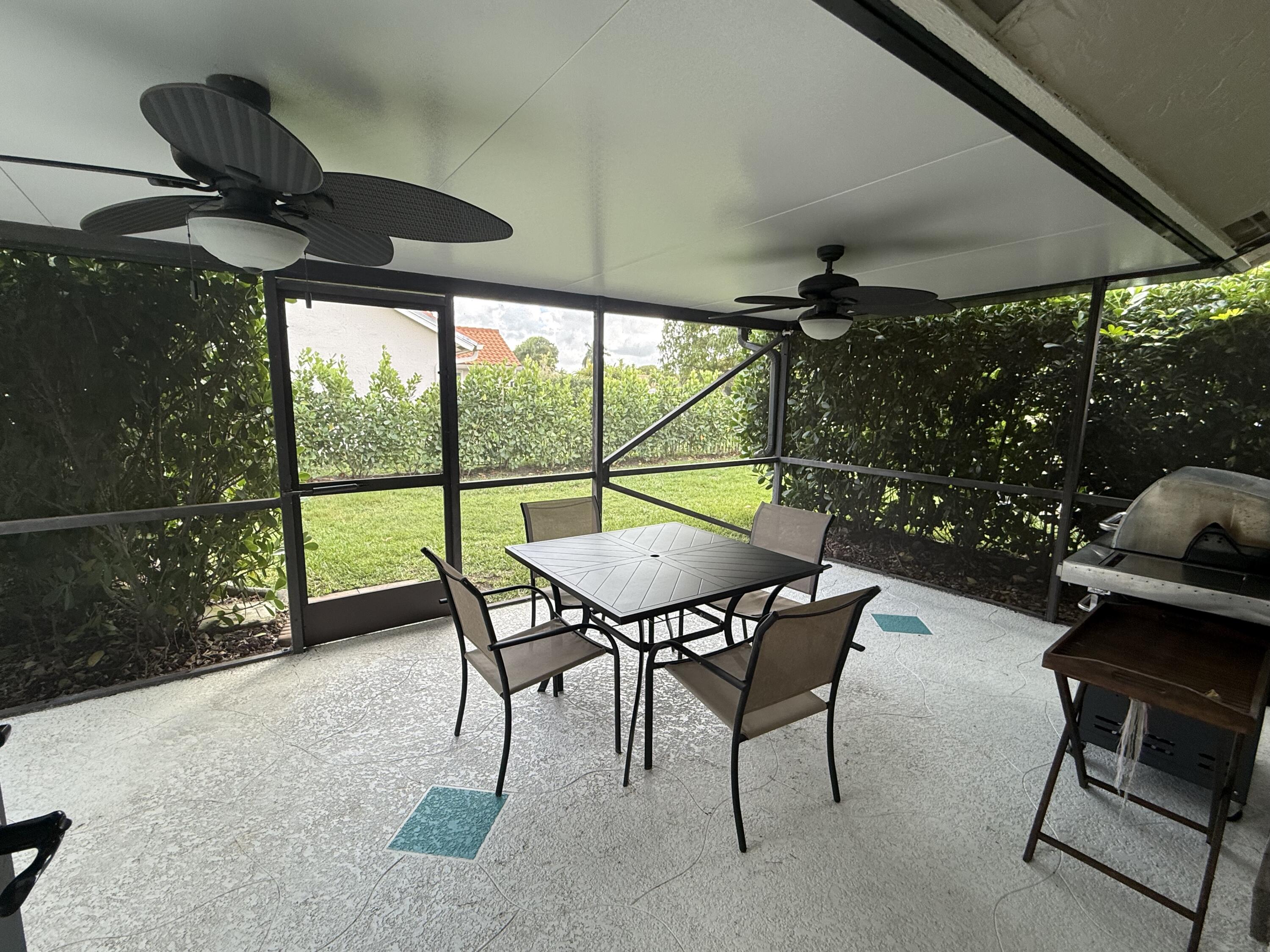 9629 El Clair Ranch Road Boynton Beach, FL 33437 - Photo 23 of 24 the screened porch