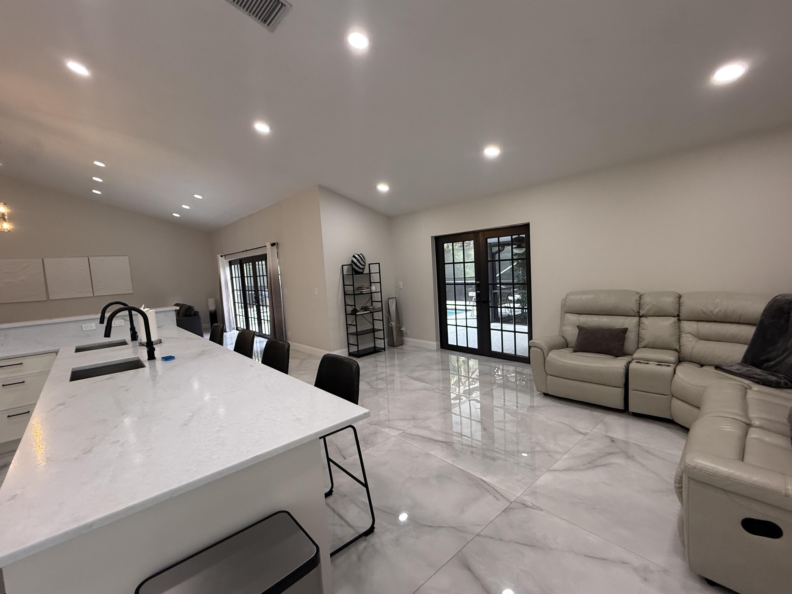 9629 El Clair Ranch Road Boynton Beach, FL 33437 - Photo 8 of 24 the family room too