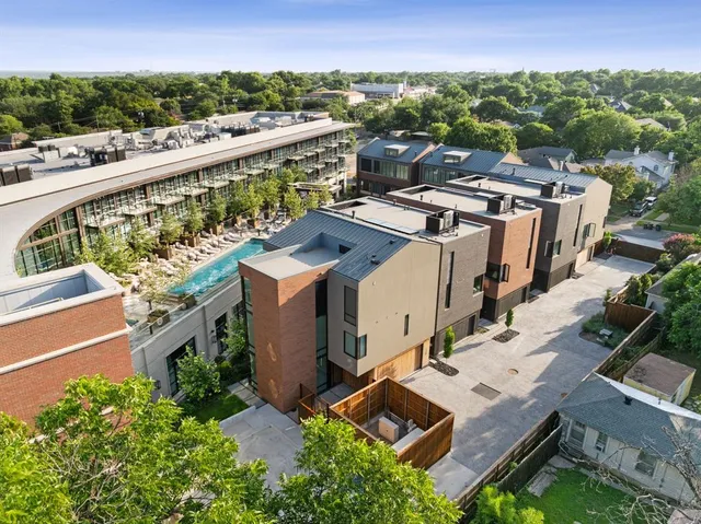 an aerial view of a house with a garden