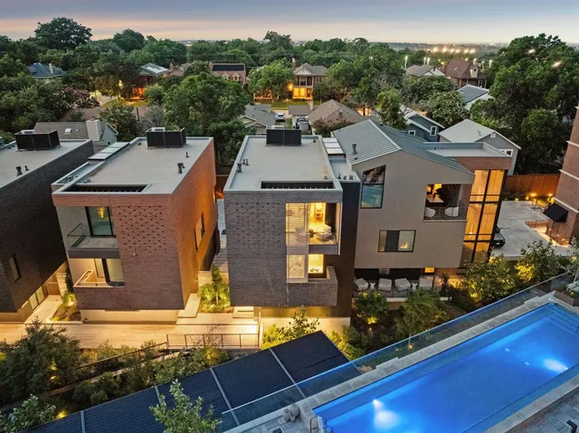 an aerial view of a house with a swimming pool