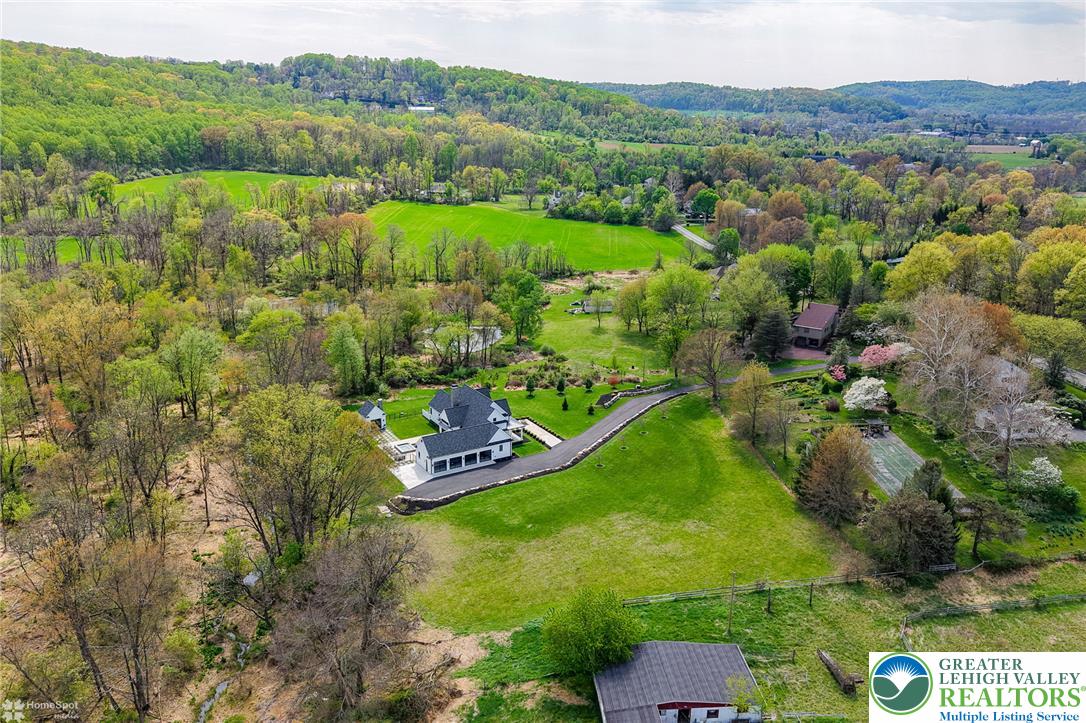 4850 West Hopewell Road Center Valley, PA 18034 - Photo 35 of 96 Experience serene country living with a grand estate nestled among verdant hills and open fields.