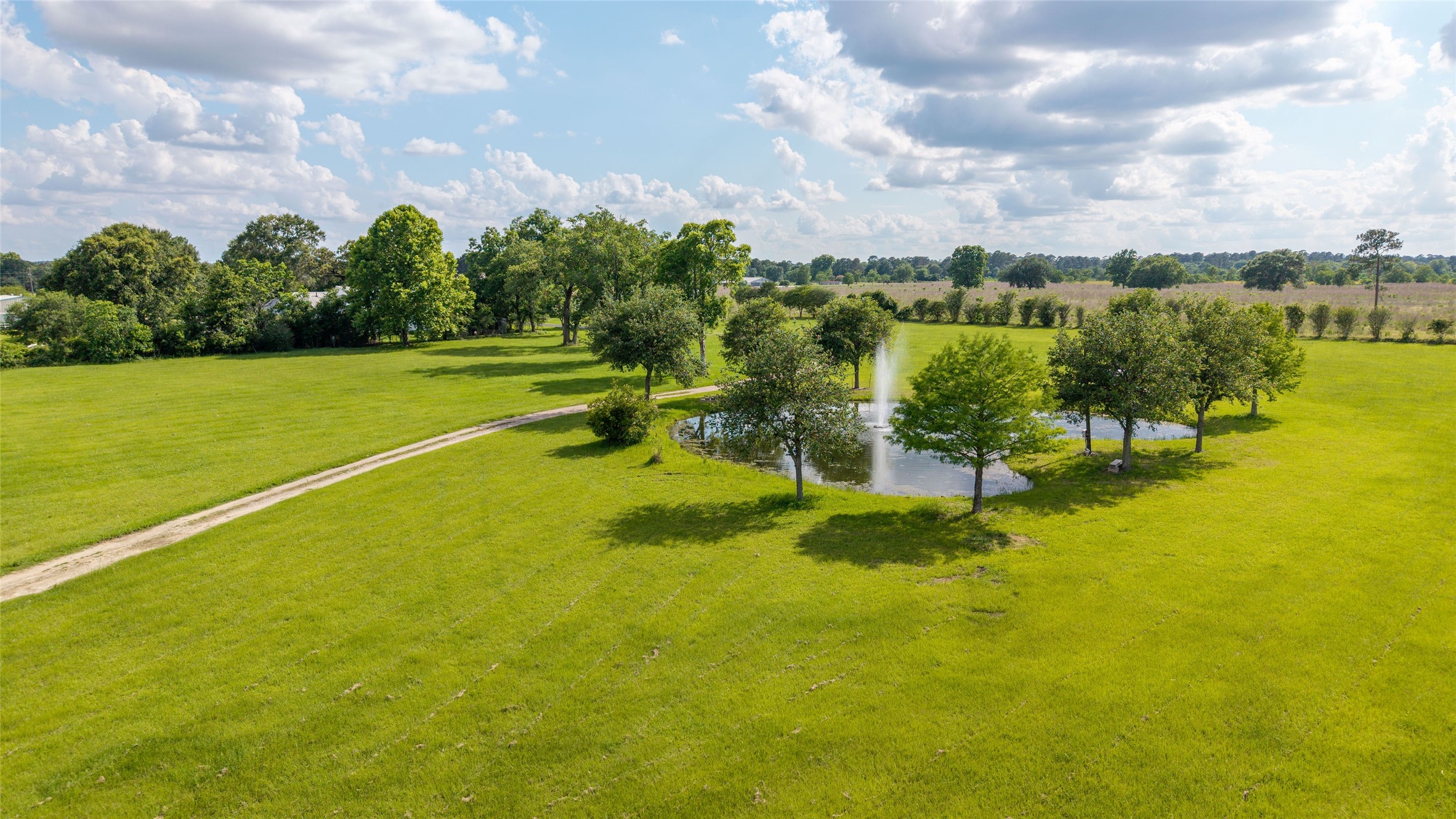 26631 Decker Prairie-Rosehill Road Magnolia, TX 77355 - Photo 15 of 20 a view of a lake with houses in the background