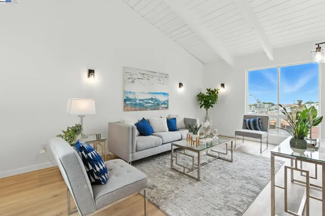 a living room with furniture potted plant and a lamp
