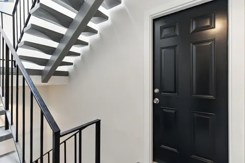 a view of room with stairs and a window