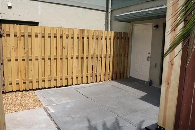 a view of a door with wooden floor