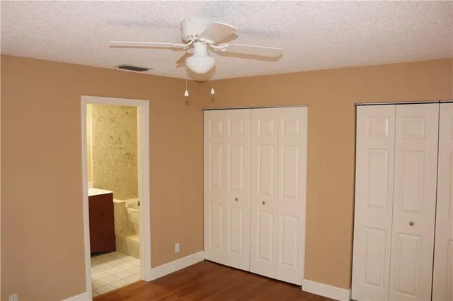 a view of an entryway with wooden floor