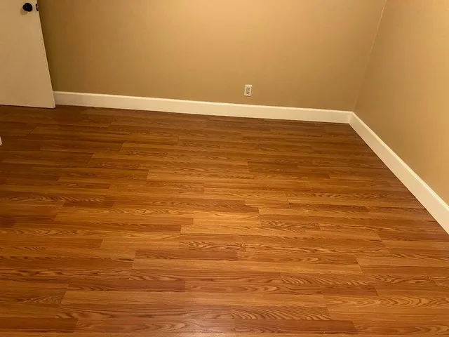 a view of room with wooden floor