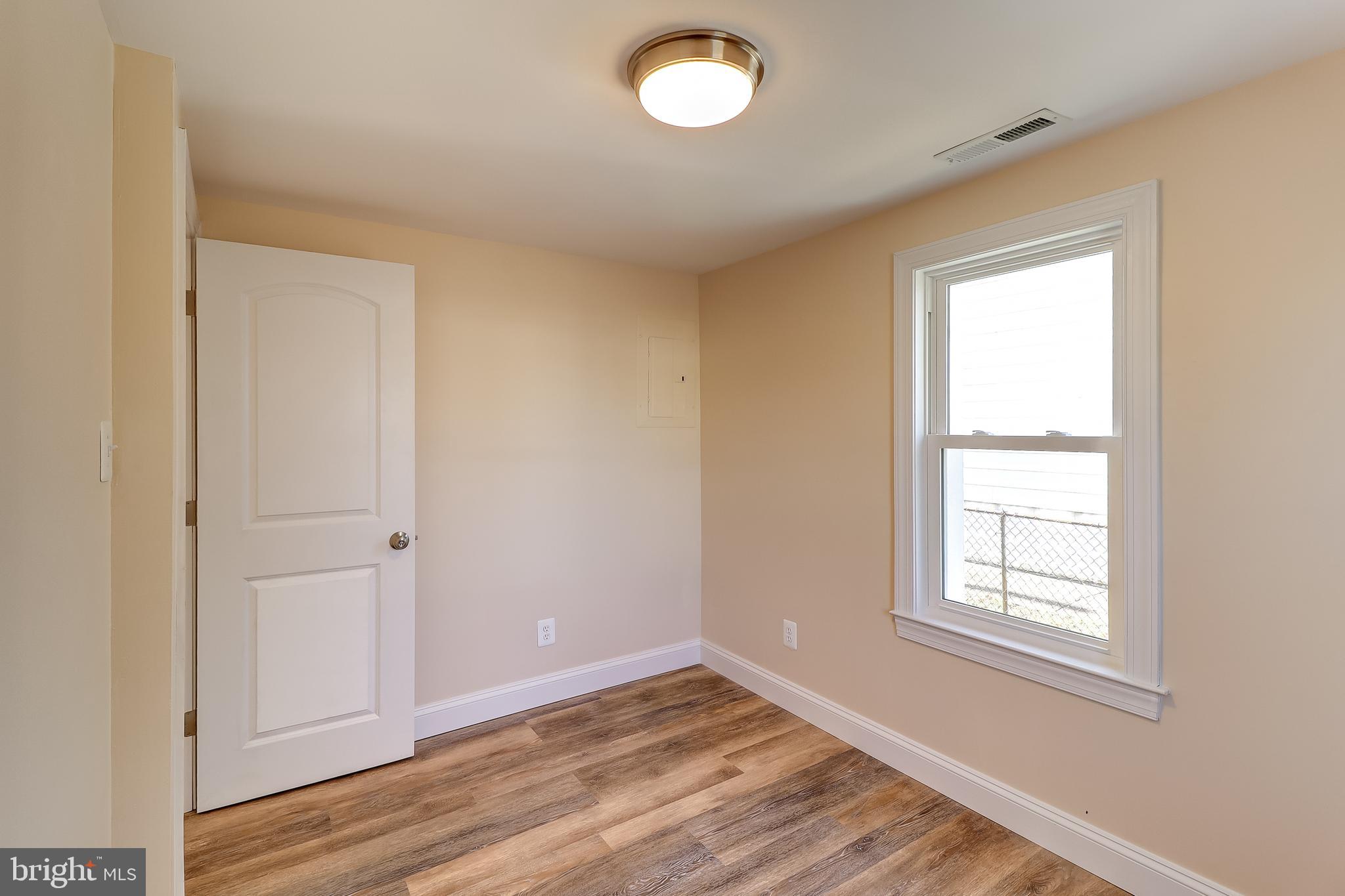 323 Homberg Avenue Baltimore, MD 21221 - Photo 21 of 30 Bedroom 2- New Vinyl Plank Flooring