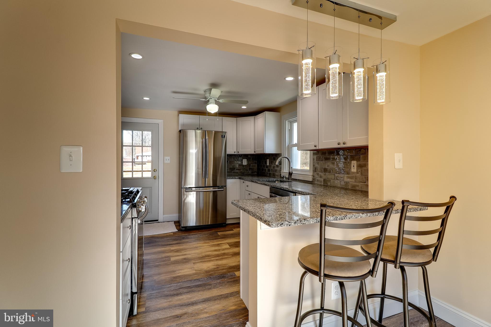 323 Homberg Avenue Baltimore, MD 21221 - Photo 9 of 30 Kitchen Breakfast Bar with stylish lighting