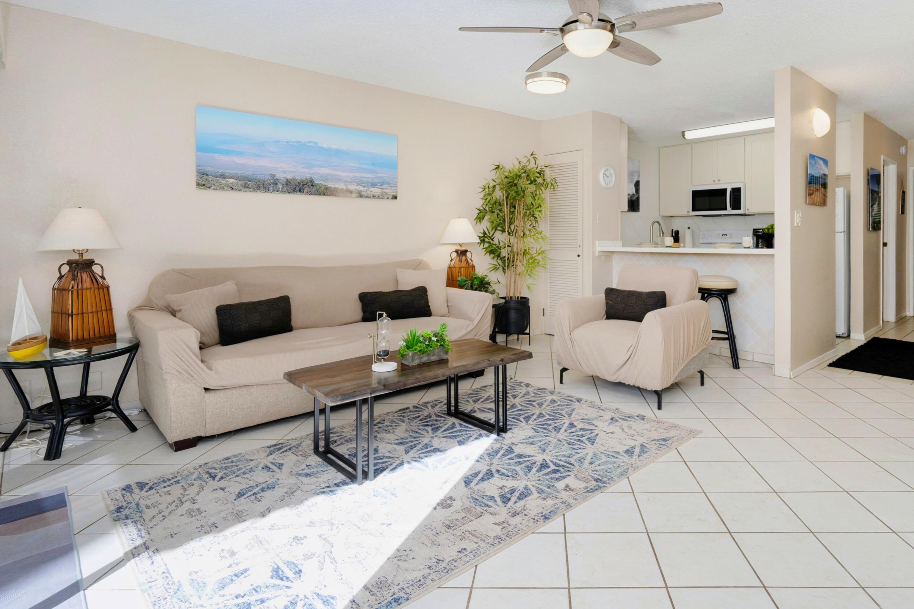 1299 Uluniu Road, Unit G104 Kihei, HI 96753 - Photo 5 of 32 a living room with furniture and white walls