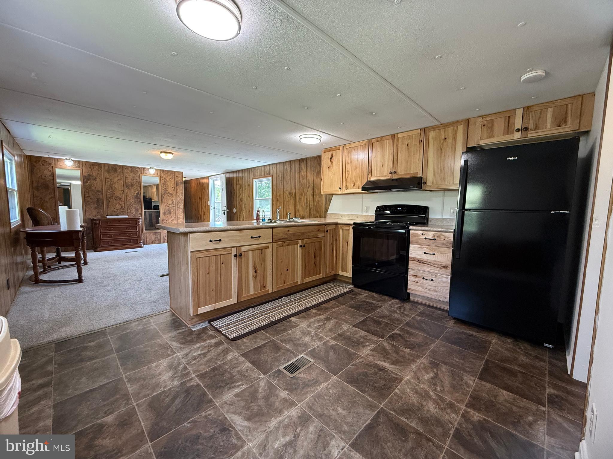192 AA Rogers Road Augusta, WV 26704 - Photo 13 of 34 a kitchen with stainless steel appliances granite countertop a refrigerator and a stove top oven