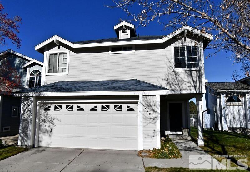 7482 Wheeldale Circle Reno, NV 89511 - Photo 1 of 1 a front view of a house with parking space