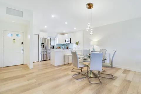 a living room with kitchen island furniture and kitchen view