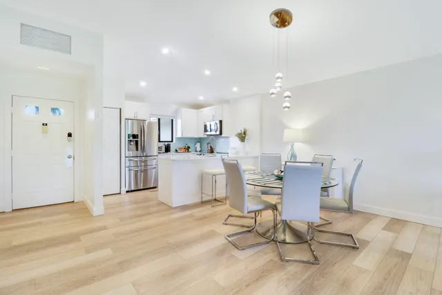 a living room with kitchen island furniture and kitchen view