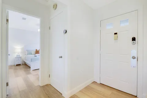 a bathroom with a sink and a wooden floor