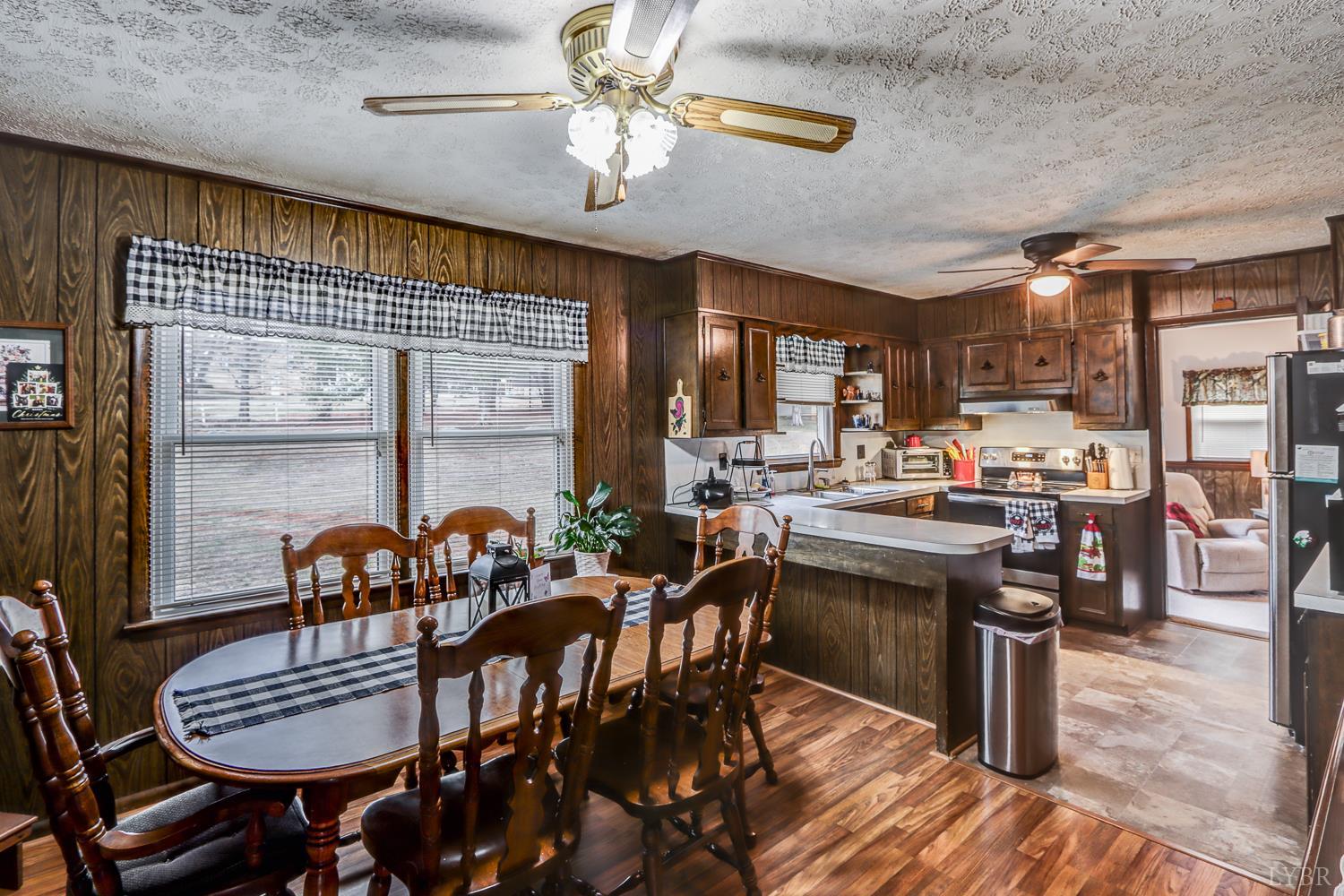 7143 Gladys Road Altavista, VA 24517 - Photo 15 of 48 a kitchen with lots of counter top space and dining table