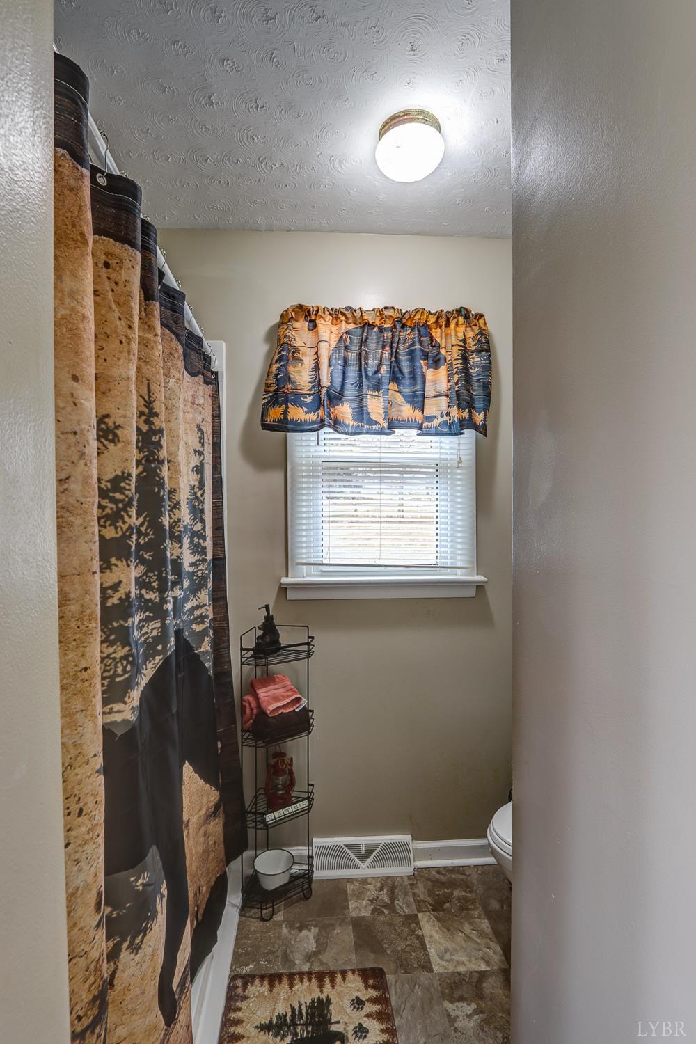 7143 Gladys Road Altavista, VA 24517 - Photo 21 of 48 a room with furniture and window