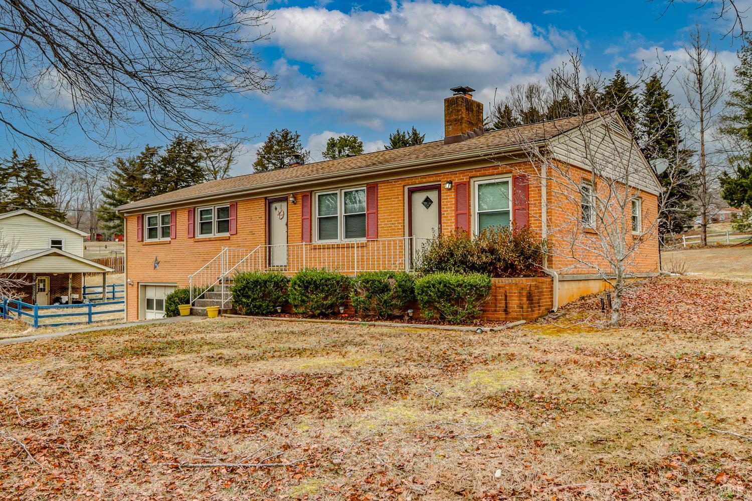 7143 Gladys Road Altavista, VA 24517 - Photo 5 of 48 a front view of a house with a yard