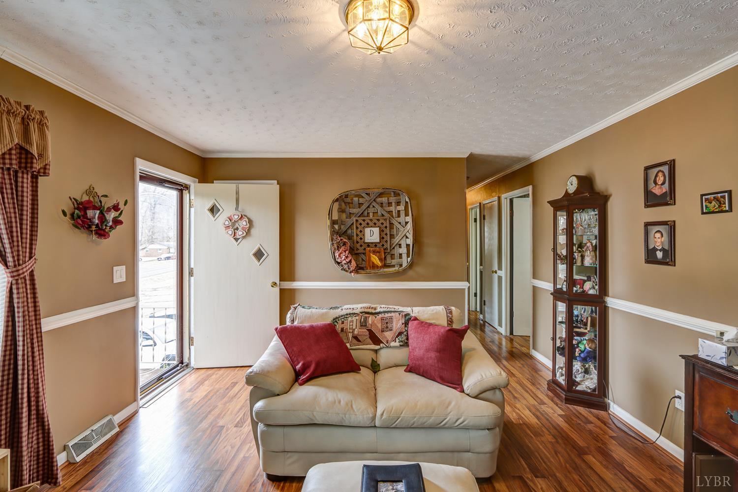 7143 Gladys Road Altavista, VA 24517 - Photo 7 of 48 a living room with furniture and a large window