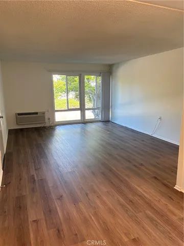 an empty room with wooden floor