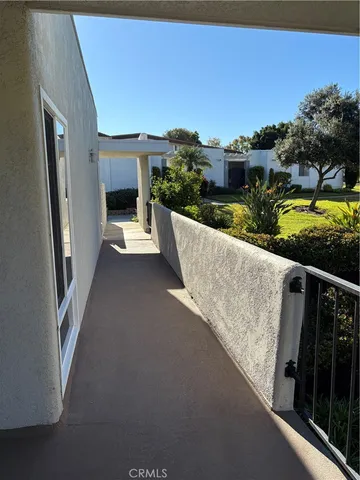 a swimming pool with outdoor seating and garden
