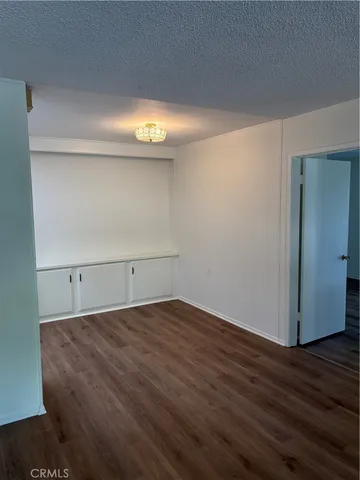 an empty room with wooden floor