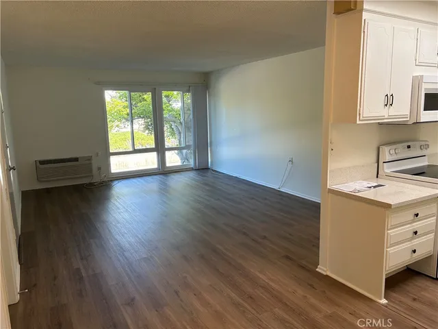 wooden floor in an empty room and a window