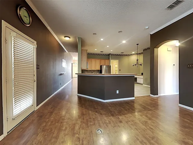a view of kitchen with wooden floor