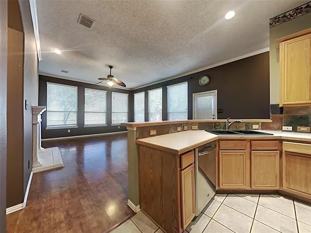 a kitchen with a sink and cabinets