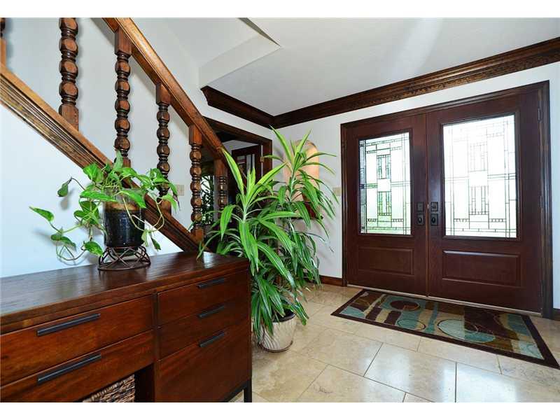 415 Pinkerton Road Wexford, PA 15090 - Photo 2 of 21 Entry/Foyer. Spacious entry with 18 in travertine tile floors, double door with decorative glass and thick crown molding. Door to lower level & 1st floor laundry with built in cabinets and travertine tile floor.