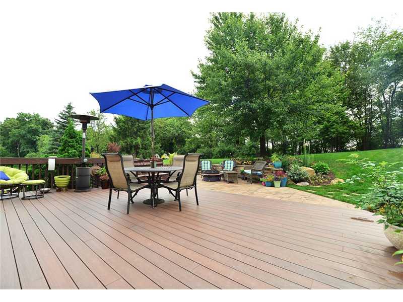 415 Pinkerton Road Wexford, PA 15090 - Photo 20 of 21 Patio/Deck. All brick home with beautiful backyard oasis! Composite deck, stamped concrete patio, stone wall with accent lights, mature landscaping, meticulously maintained. Over looks woods.