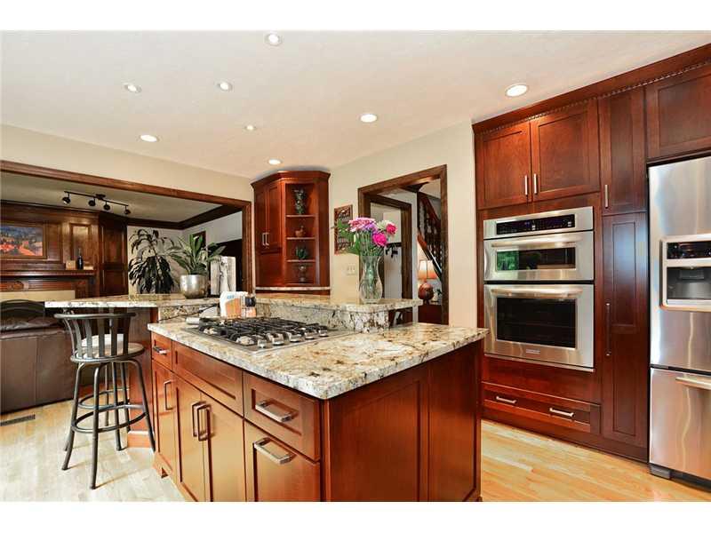 415 Pinkerton Road Wexford, PA 15090 - Photo 4 of 21 Kitchen. Stainless appliances including gas cook top, double oven (oven/microwave oven combo), refrigerator, and trash compactor. Also has disposal & hot water dispenser! Plenty of cabinet space & storage, including a charging station!