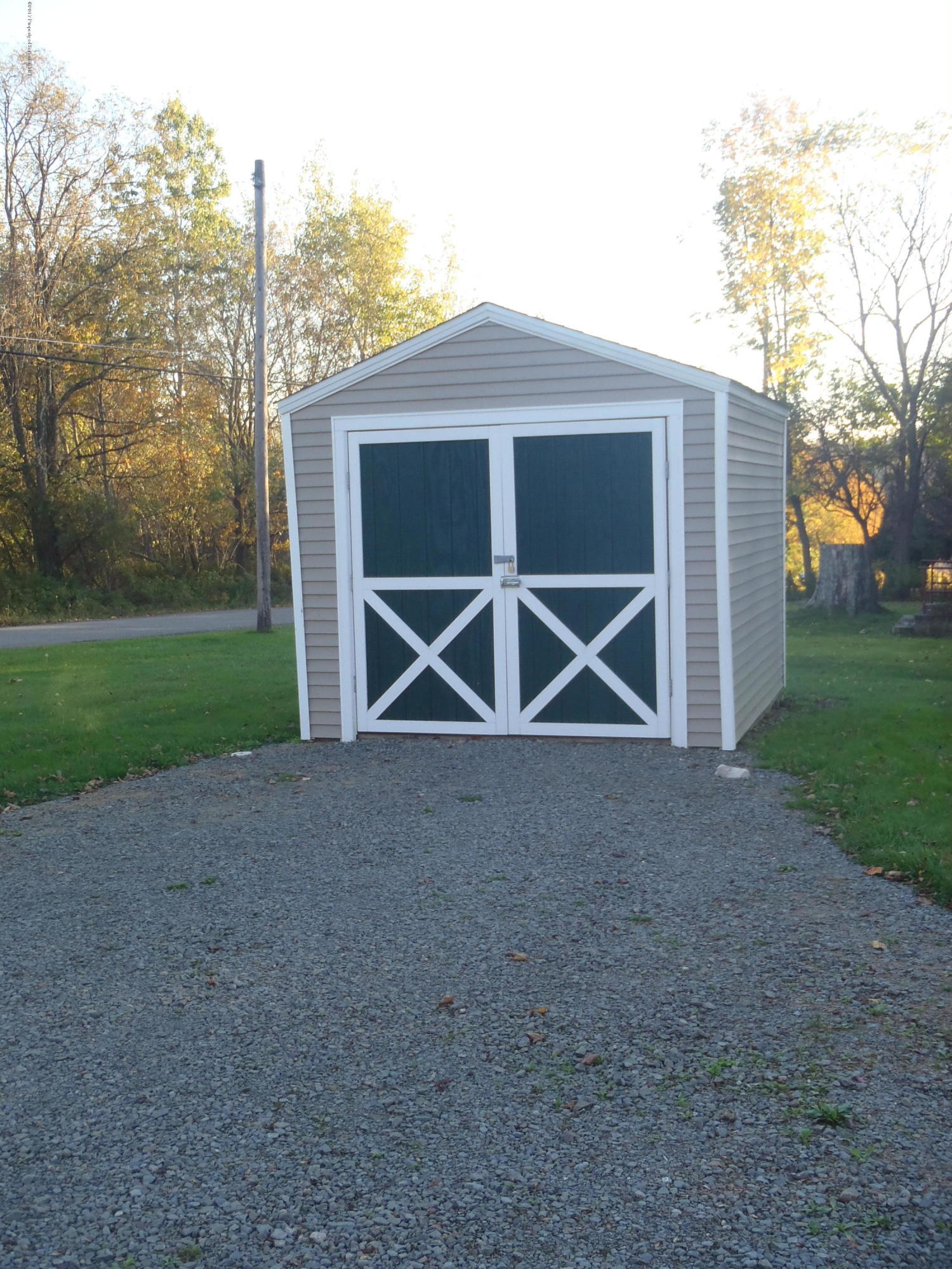 5441 Cottrell Road Union Dale, PA 18470 - Photo 17 of 19 a front view of a house with parking space and garage