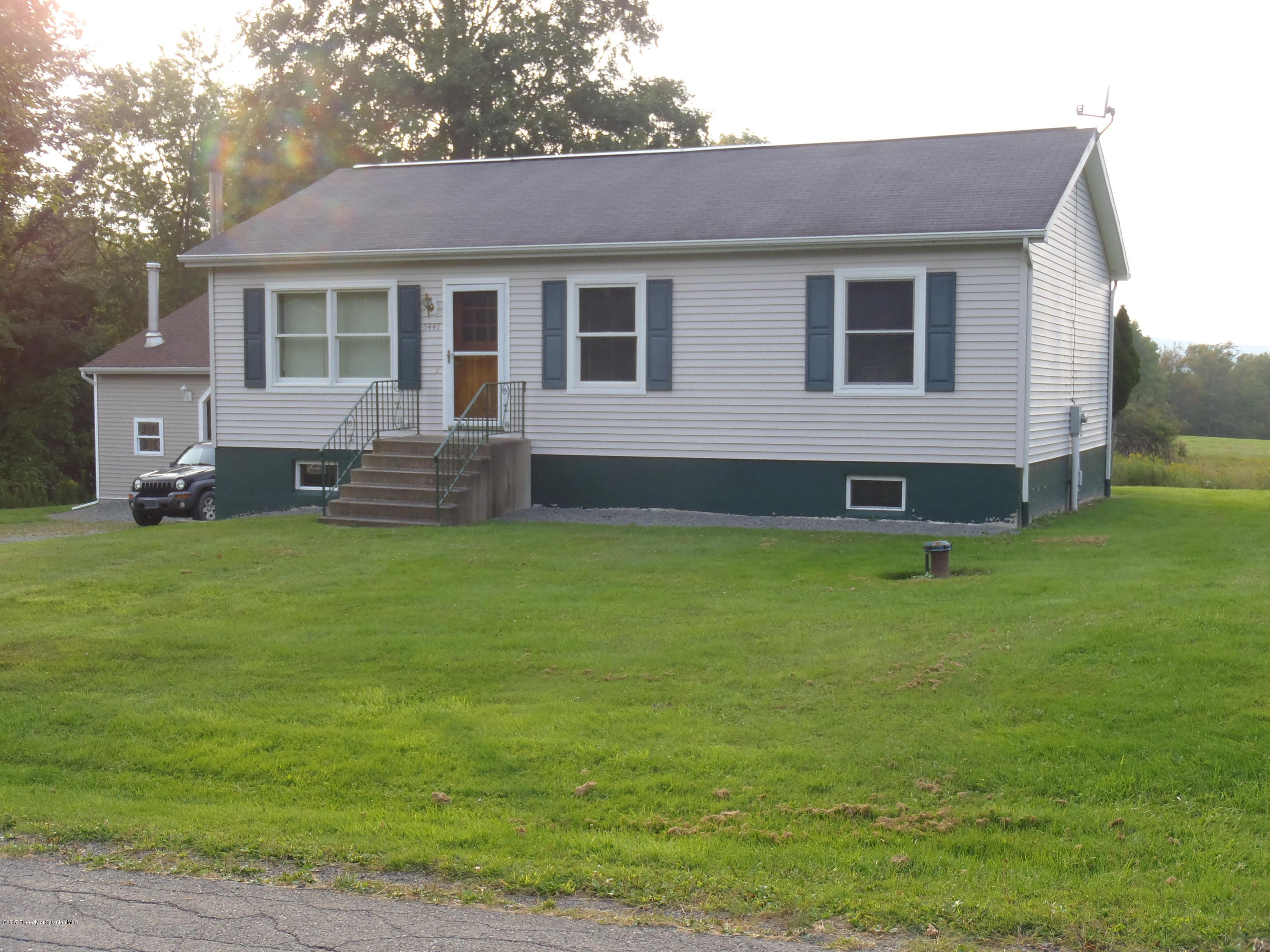5441 Cottrell Road Union Dale, PA 18470 - Photo 4 of 19 a front view of house with yard and outdoor seating