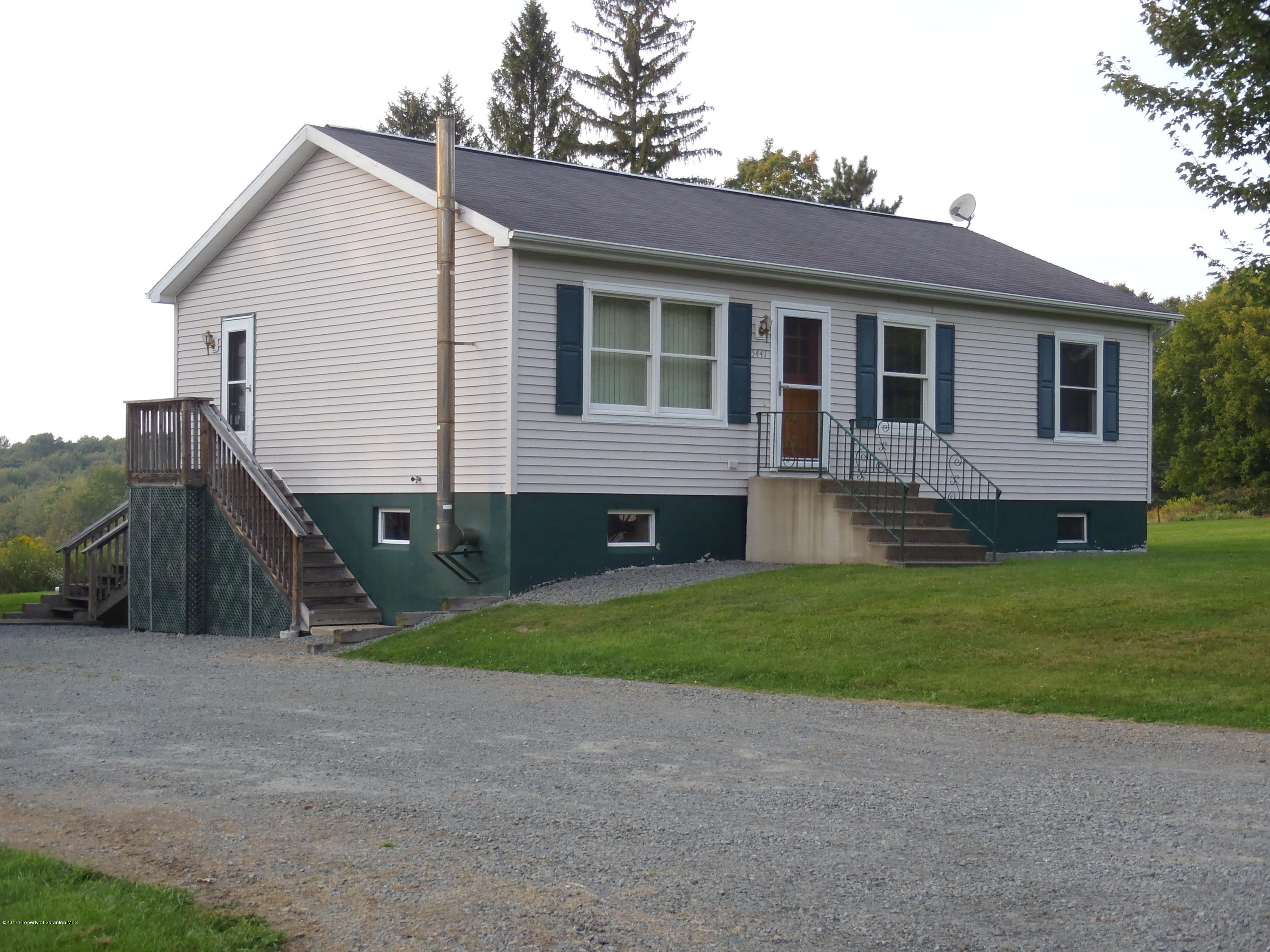 5441 Cottrell Road Union Dale, PA 18470 - Photo 6 of 19 a view of house with a yard