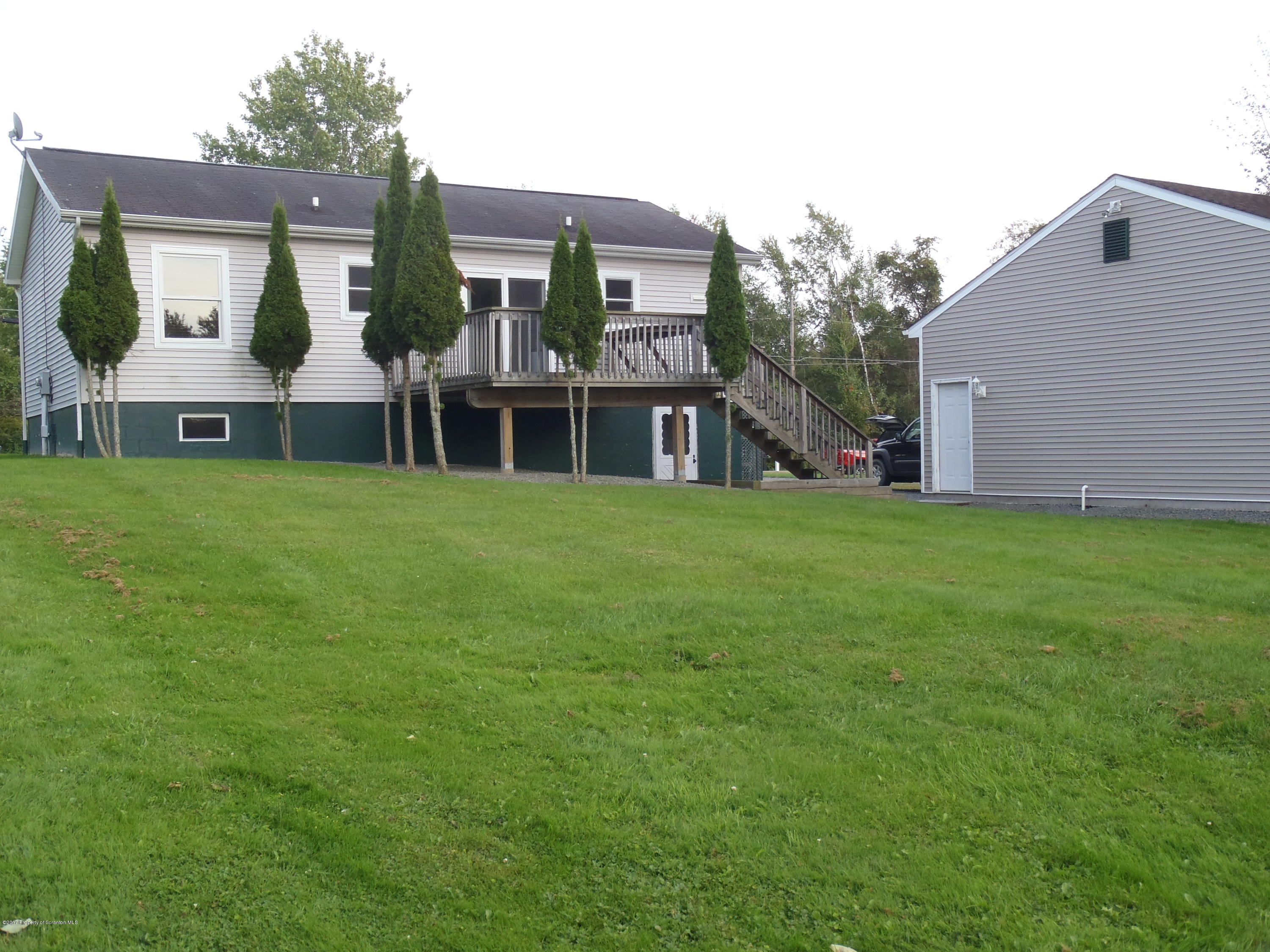5441 Cottrell Road Union Dale, PA 18470 - Photo 8 of 19 a front view of house with yard and green space